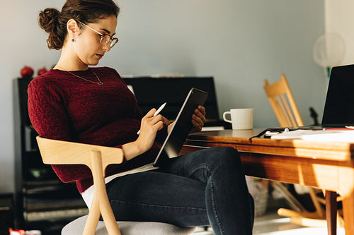 Female illustrator working at home