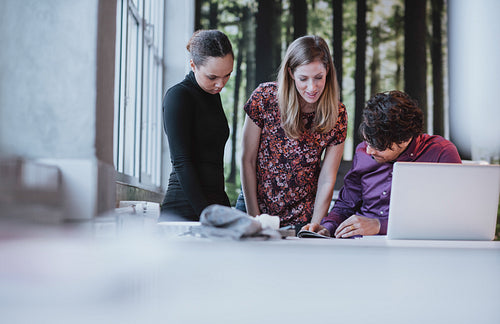 Young business team working together on a creative idea