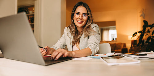 Creative businesswoman working in her home office