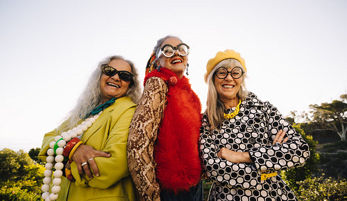 Stylish senior women smiling happily in a park