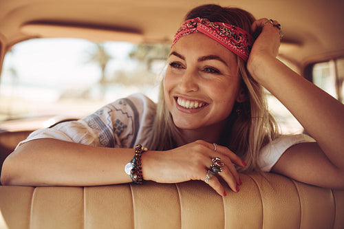 Woman sitting in the car and looking away