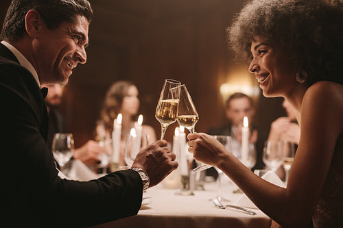 Couple at party enjoying drink