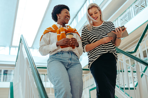 Female colleagues walking at work
