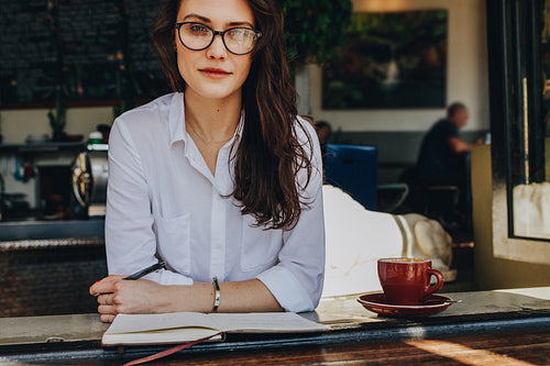 Confident woman at coffee shop