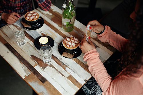Women at restaurant with two cup of coffee