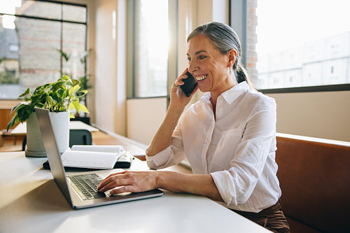 Mature professional talking on cell phone