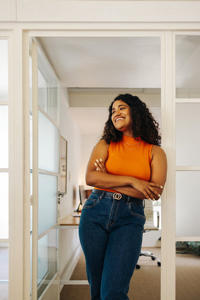 Cheerful female entrepreneur smiling in an office