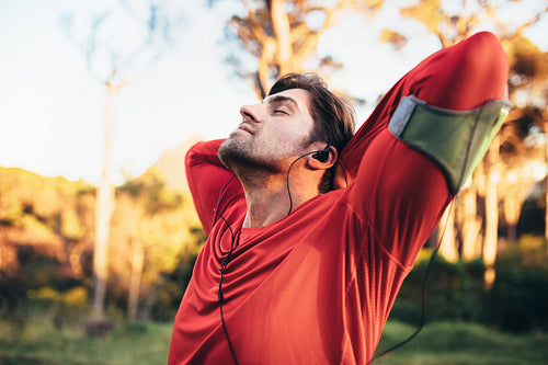 Man relaxing while listening to music