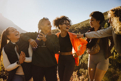 Group of friends laughing outdoors