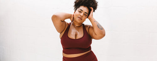 Confident fitness woman relaxing after workout