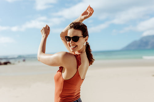 Smiling woman at a beach