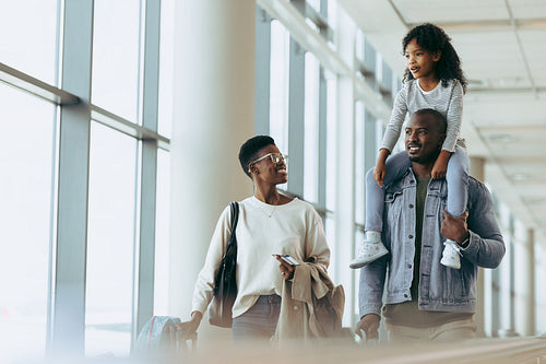 Happy family at airport going on holiday