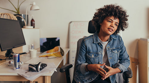 Computer programmer discussing work with team