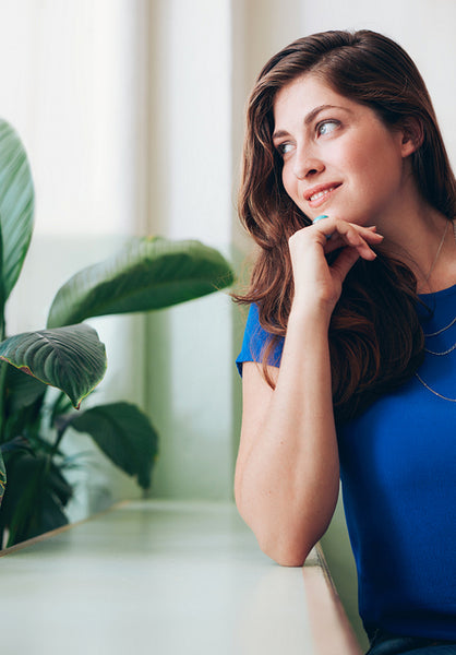 Portrait of beautiful young woman looking away