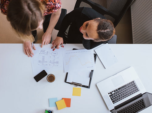Two young woman working together on a new business project