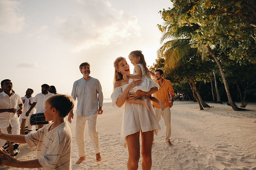 Family enjoying a traditional entertainment at a luxury beach resort