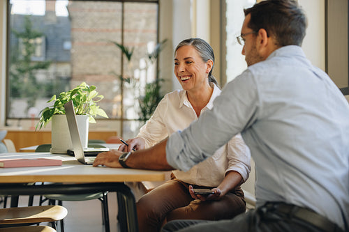 Coworkers having new project discussion