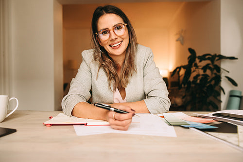 Cheerful interior designer attending an online meeting