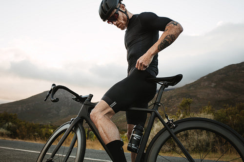 Cyclist practicing outdoors on mountain road