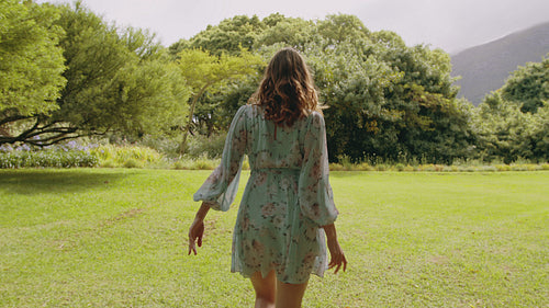 Pretty woman in a park enjoying nature