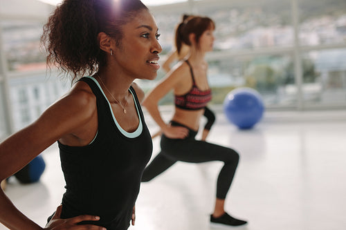 Woman exercising in gym class