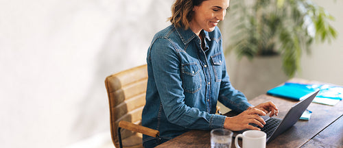 Successful entrepreneur engaged in productive work on laptop