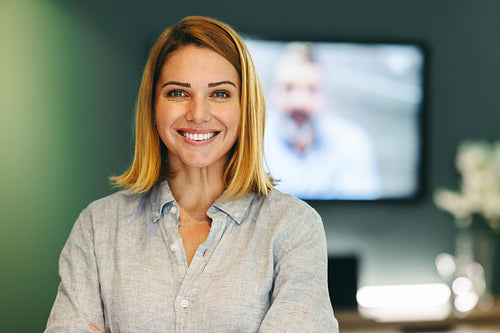 Successful female entrepreneur standing in a modern office
