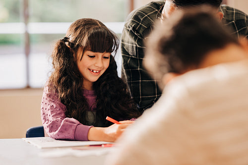 Happy child enjoys being part of a literacy class in elementary school