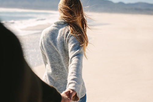 Couple walking along the beach