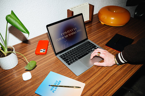 An organized workspace keeps work moving on a laptop in the home office.