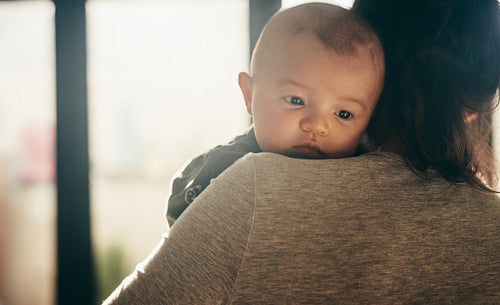 Close up of a baby with her mother