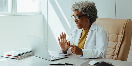 Female doctor conducting online consultation in healthcare office