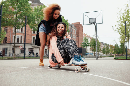 Girls enjoying skating outdoors