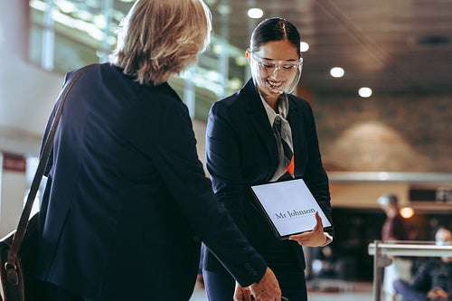 Chauffeur receiving businessman at airport during pandemic
