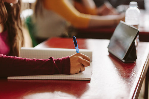 Girl studying in university classroom