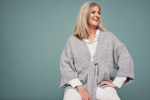 Mature woman laughing in a studio