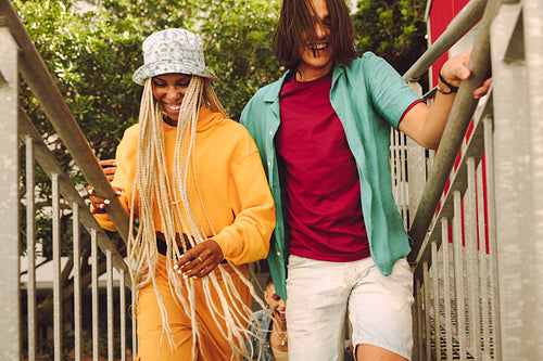 Friends running up the stairs together