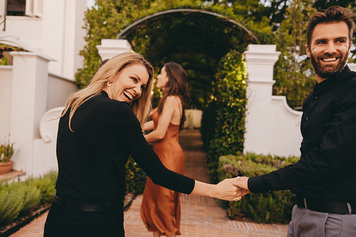 Cheerful couple smiling outside a couples retreat venue