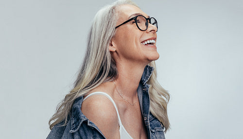 Cheerful senior woman looking at copy space