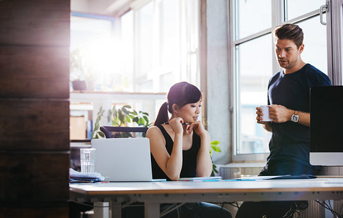 Team of professional employees discussing business ideas