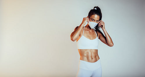 Sporty woman with medical mask