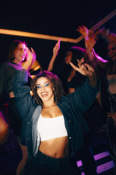Young women dancing and enjoying a fun night out together