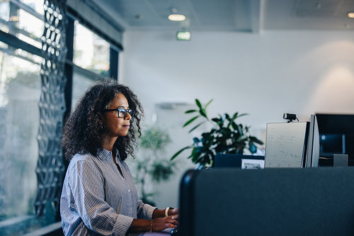 Businesswoman busy working at her desk