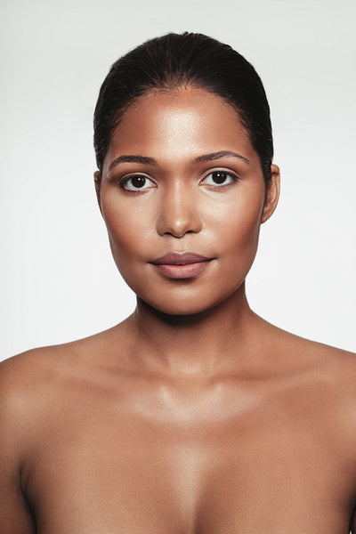 Shirtless young woman with makeup