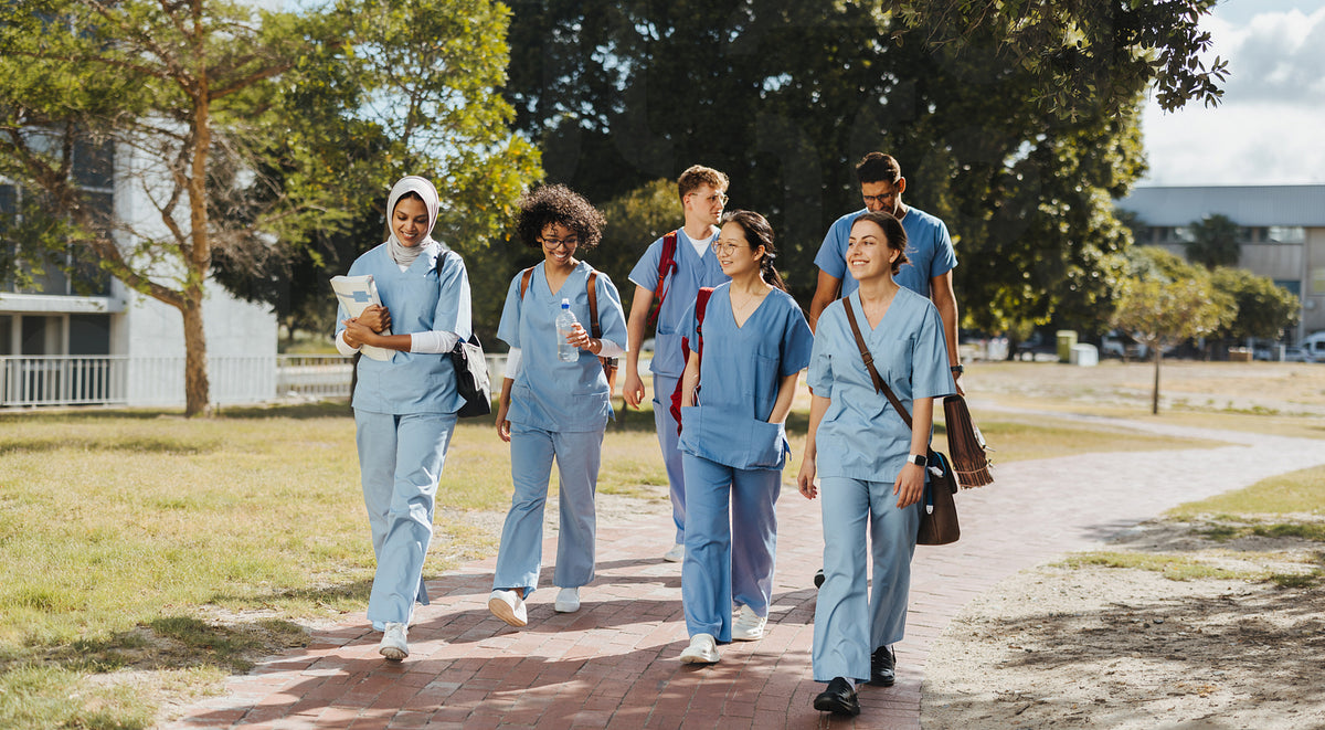 Medical students wearing scrubs walking together after class – Jacob ...