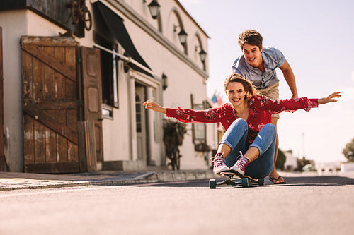 Woman enjoying a skateboard ride on the street