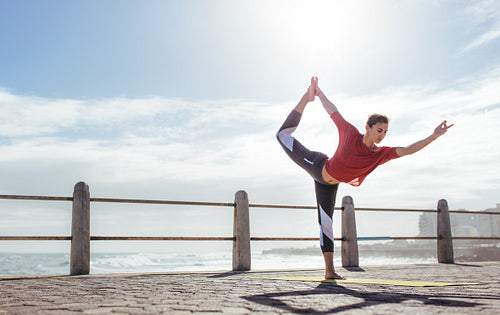 Fitness woman doing yoga Natarajasana pose