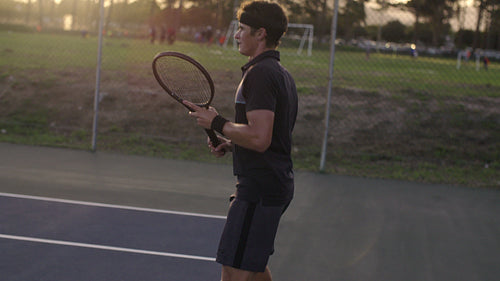 Tennis player hitting forehands from baseline