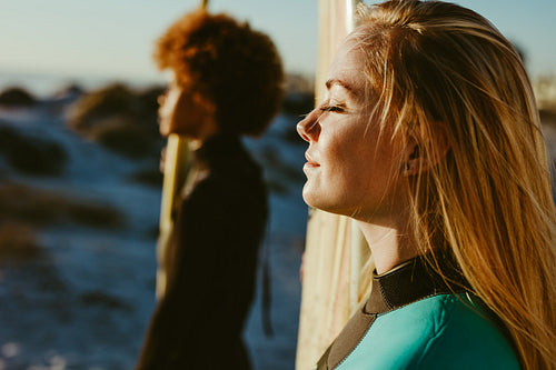 Female surfers relaxing at the beach