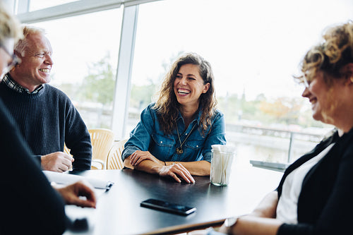Business people smiling during a meeting